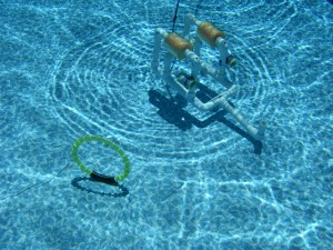 Marine Research students testing an ROV in a pool performing a "mission"